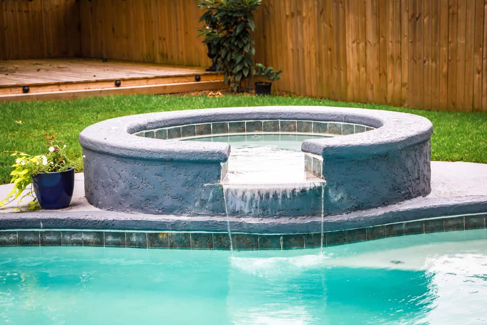 Blog hero photo for "Everything You Need to Know About In-Ground Spa Installation" — relevant completed pool/backyard project