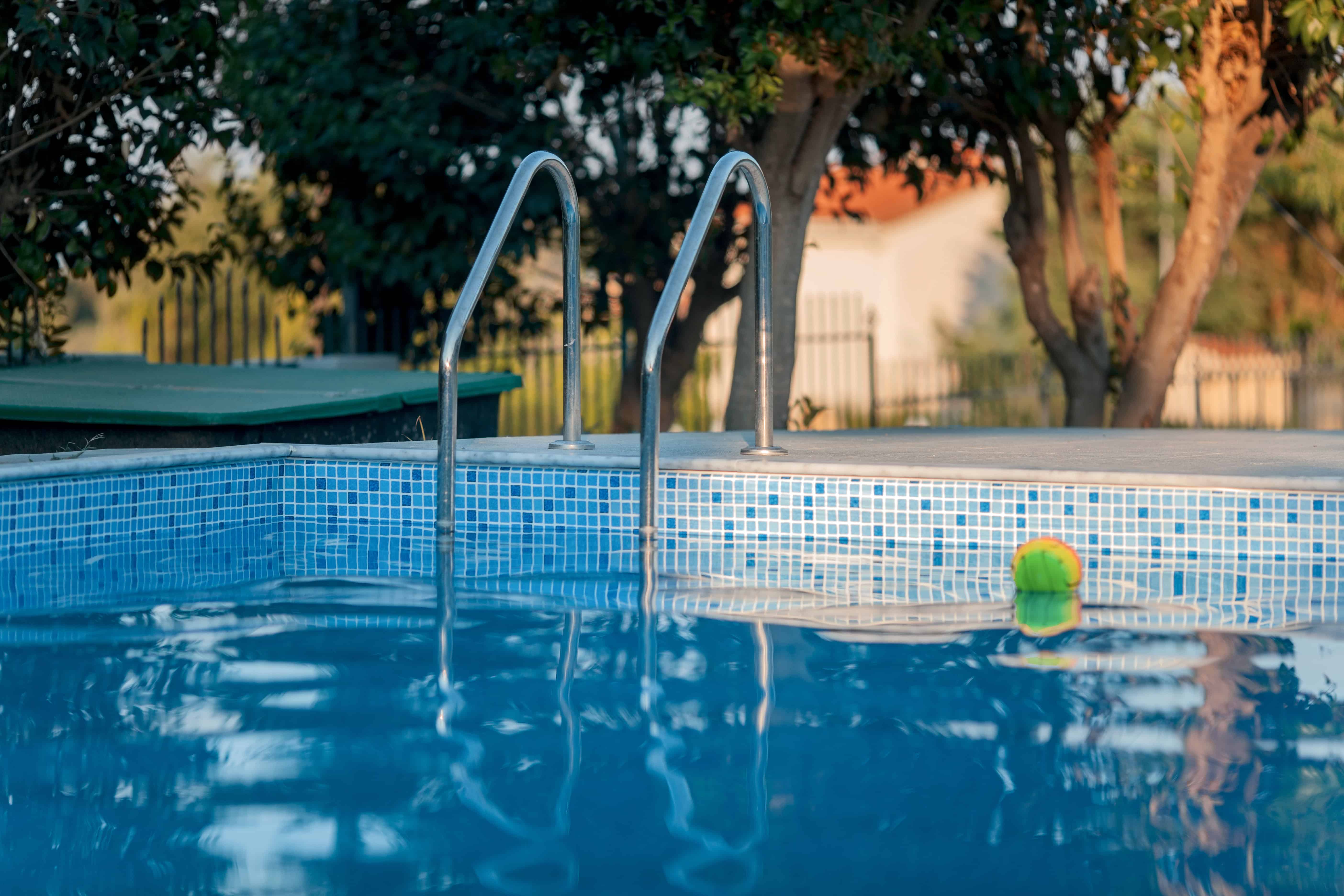 Blog hero photo for "What are the Benefits of a Pool?" — relevant completed pool/backyard project