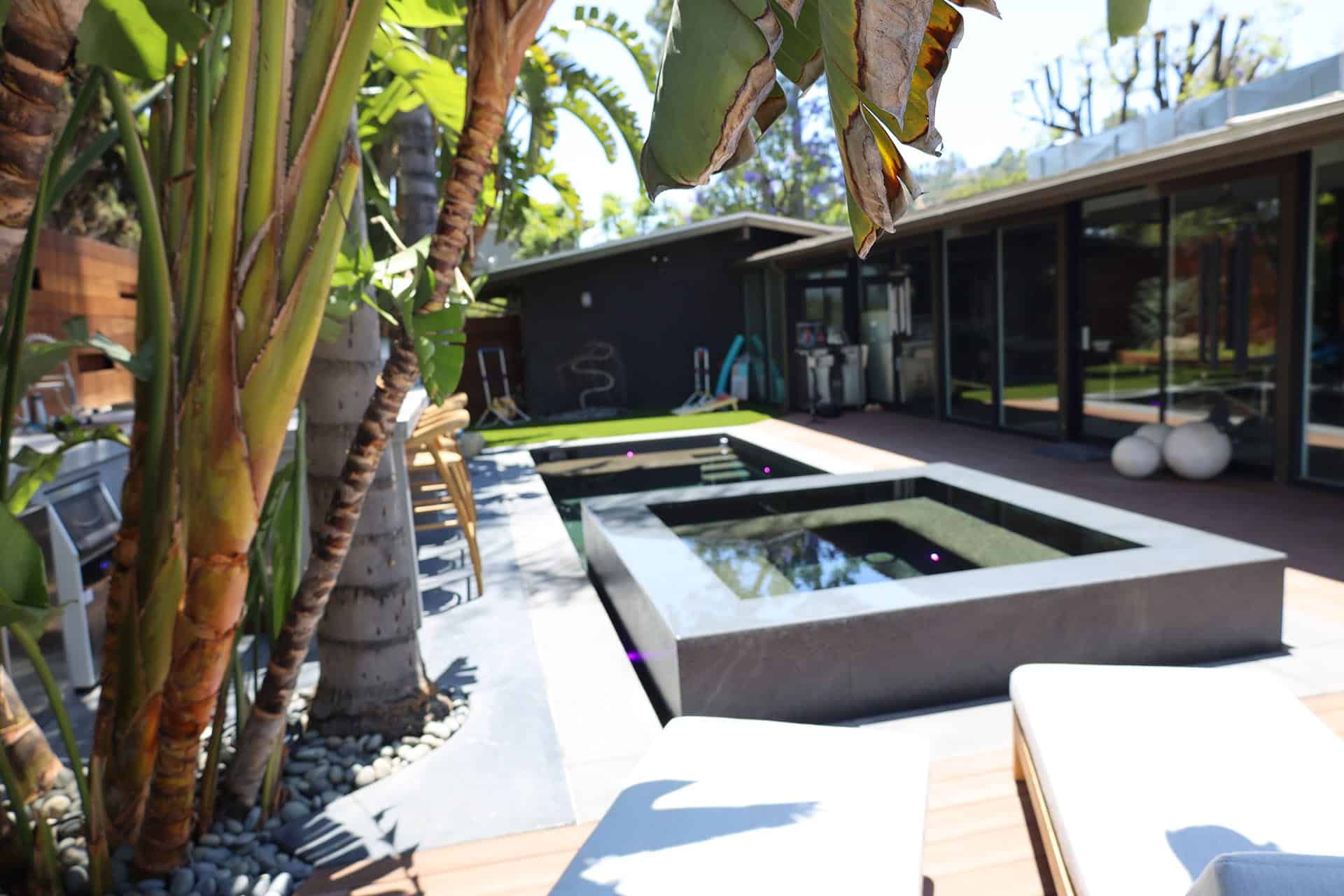 Geometric pool and spa with poured-concrete coping